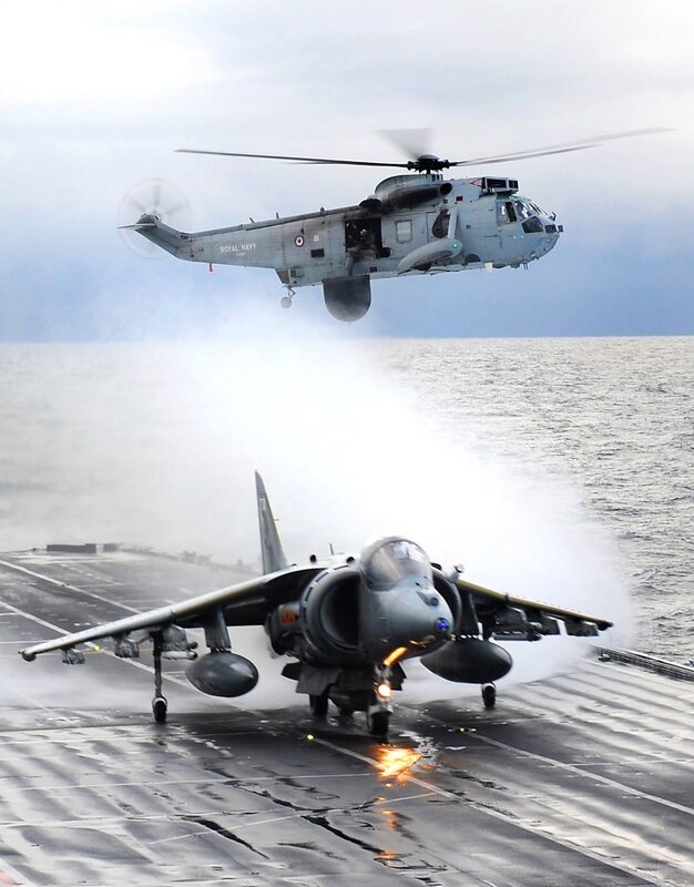 Harrier jet and helicopter on aircraft carrier