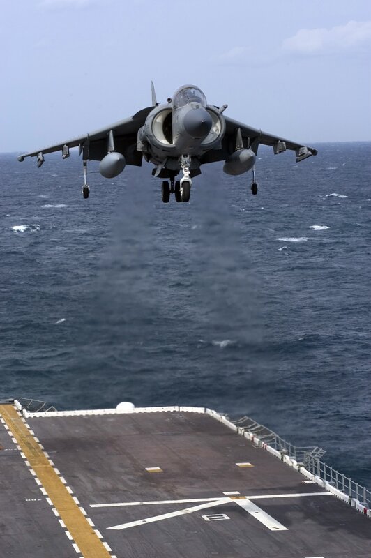 Harrier jet taking off from aircraft carrier