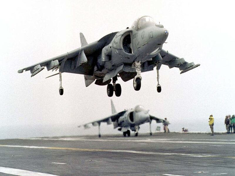 Harrier jet taking off from aircraft carrier