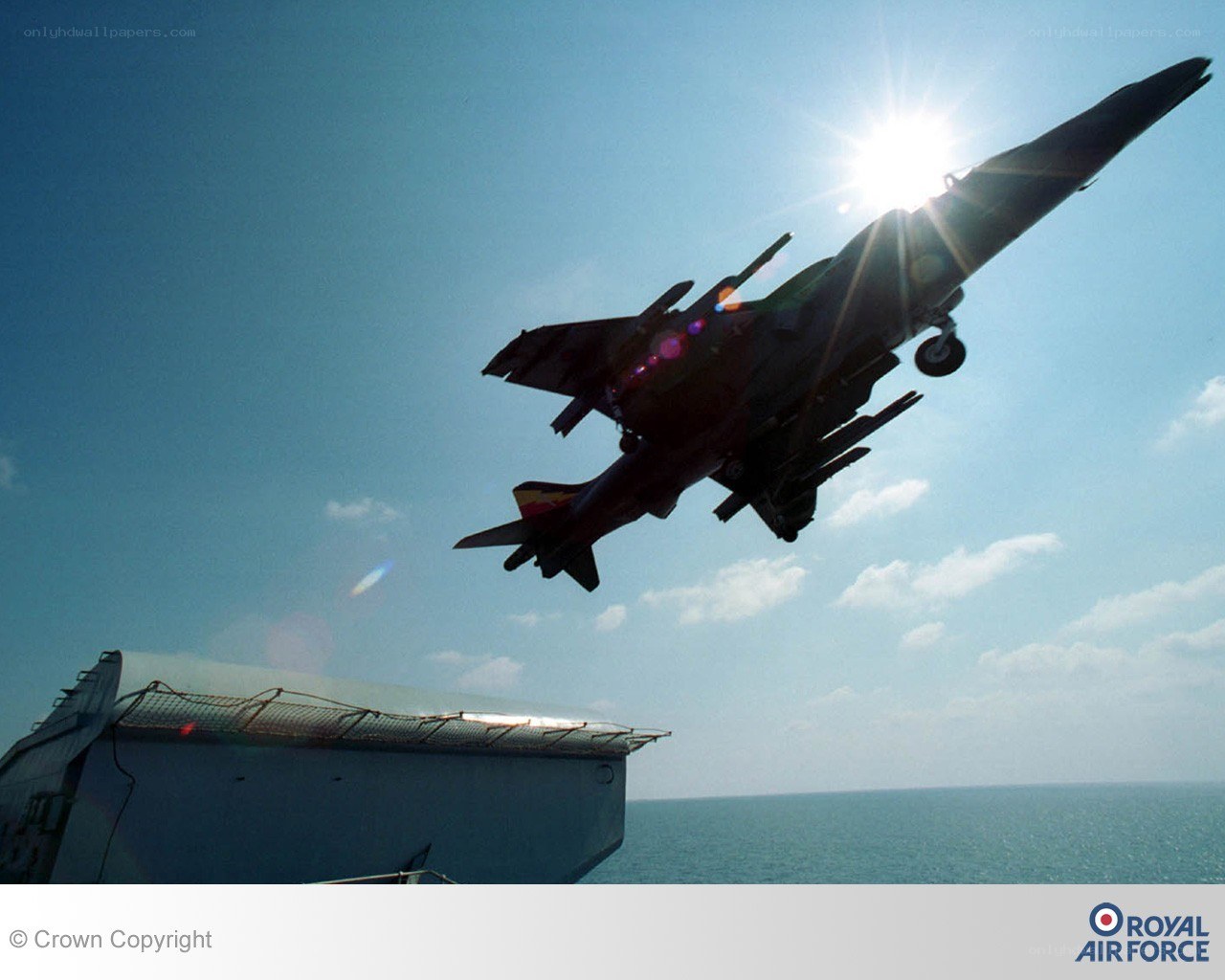 Harrier jet taking off from ship