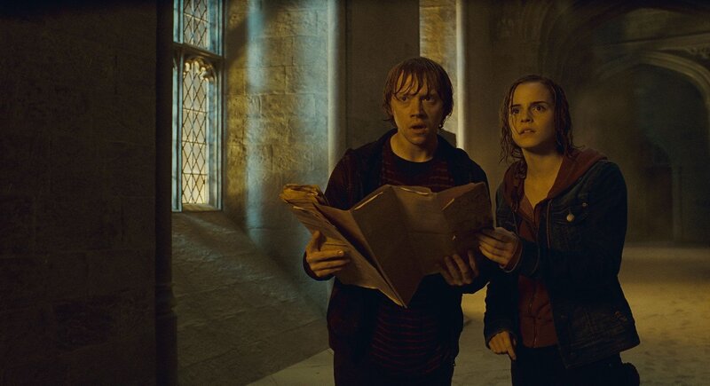 Harry and Hermione in a castle corridor