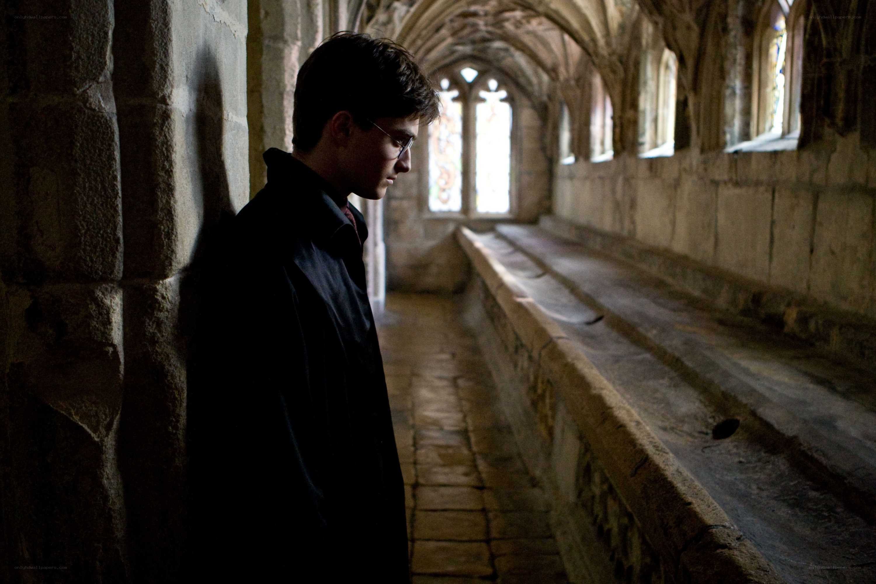 Harry Potter in a stone corridor