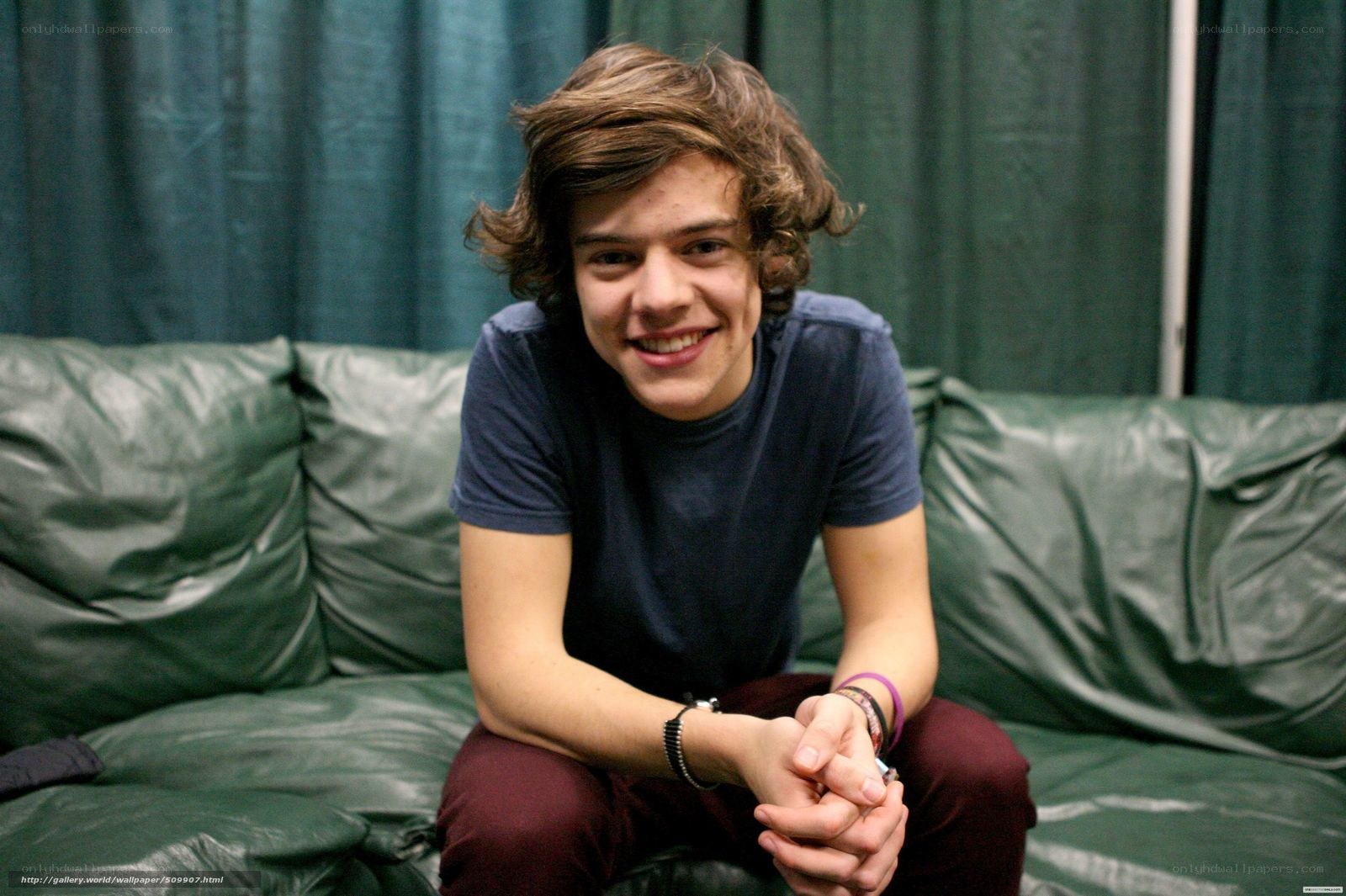 Harry Styles on a green couch