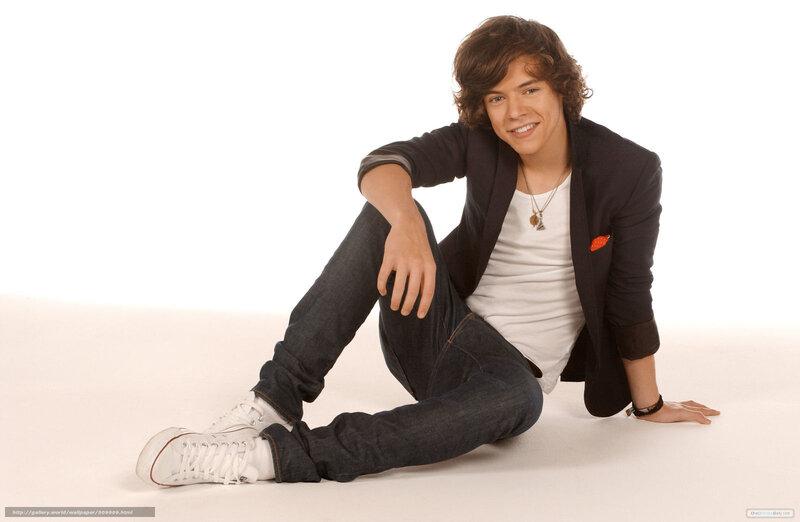 Harry Styles sitting on floor
