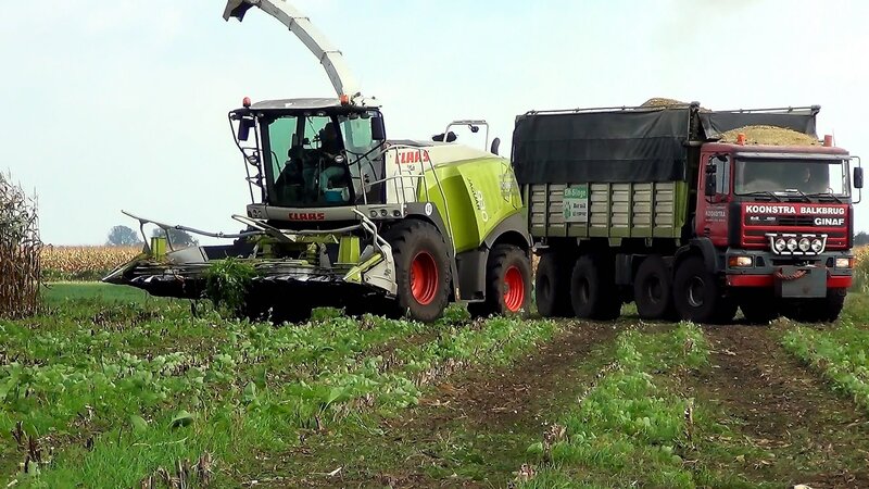 Harvester and Truck in Field