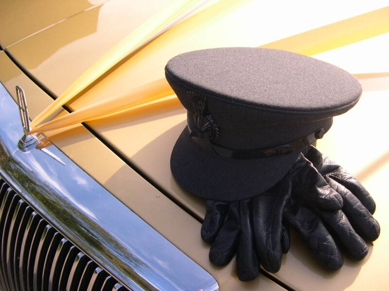 Hat and gloves on vintage car