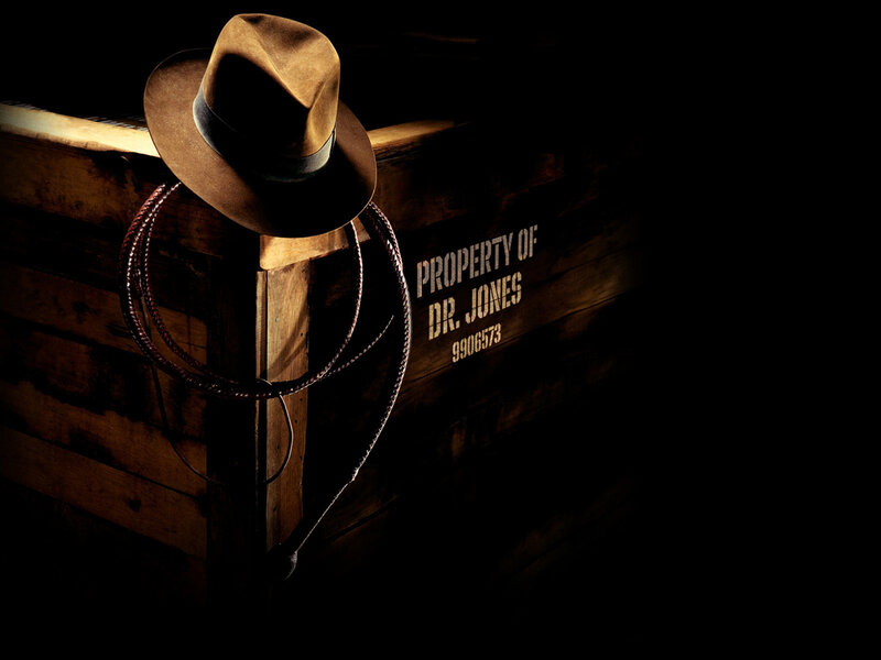Hat and whip on wooden crate