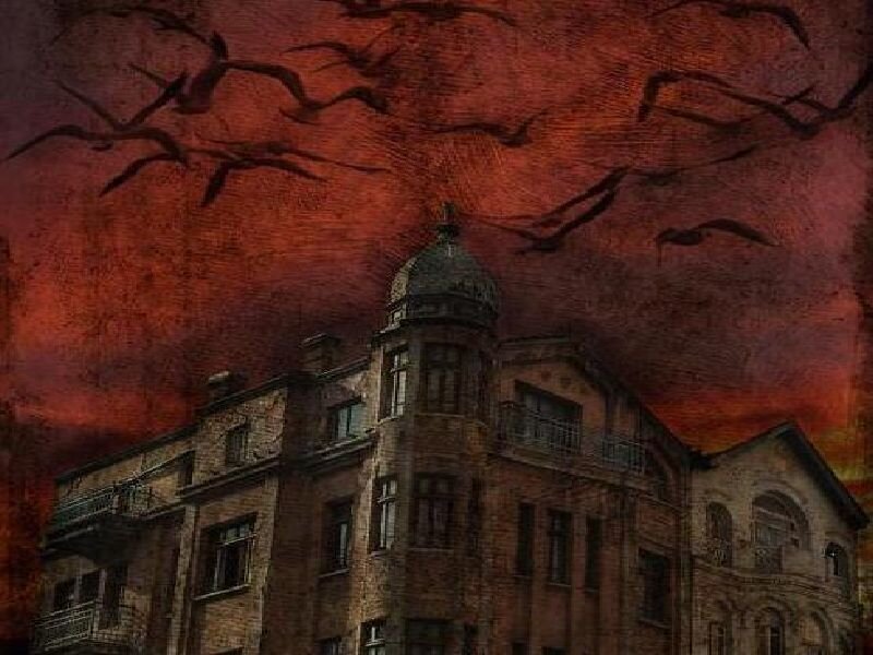 haunted building under red sky