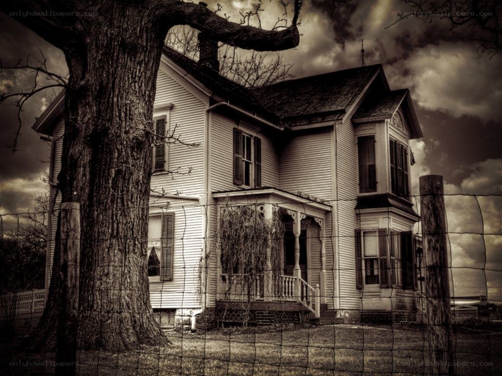 haunted house behind fence