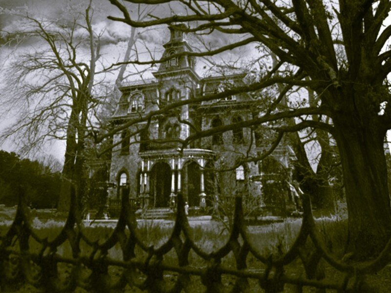 haunted mansion behind fence