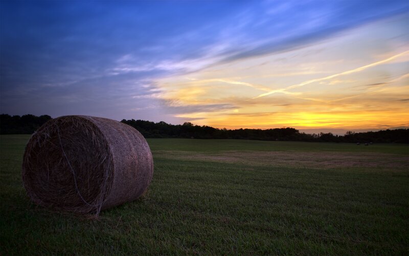 Hay bale at sunset