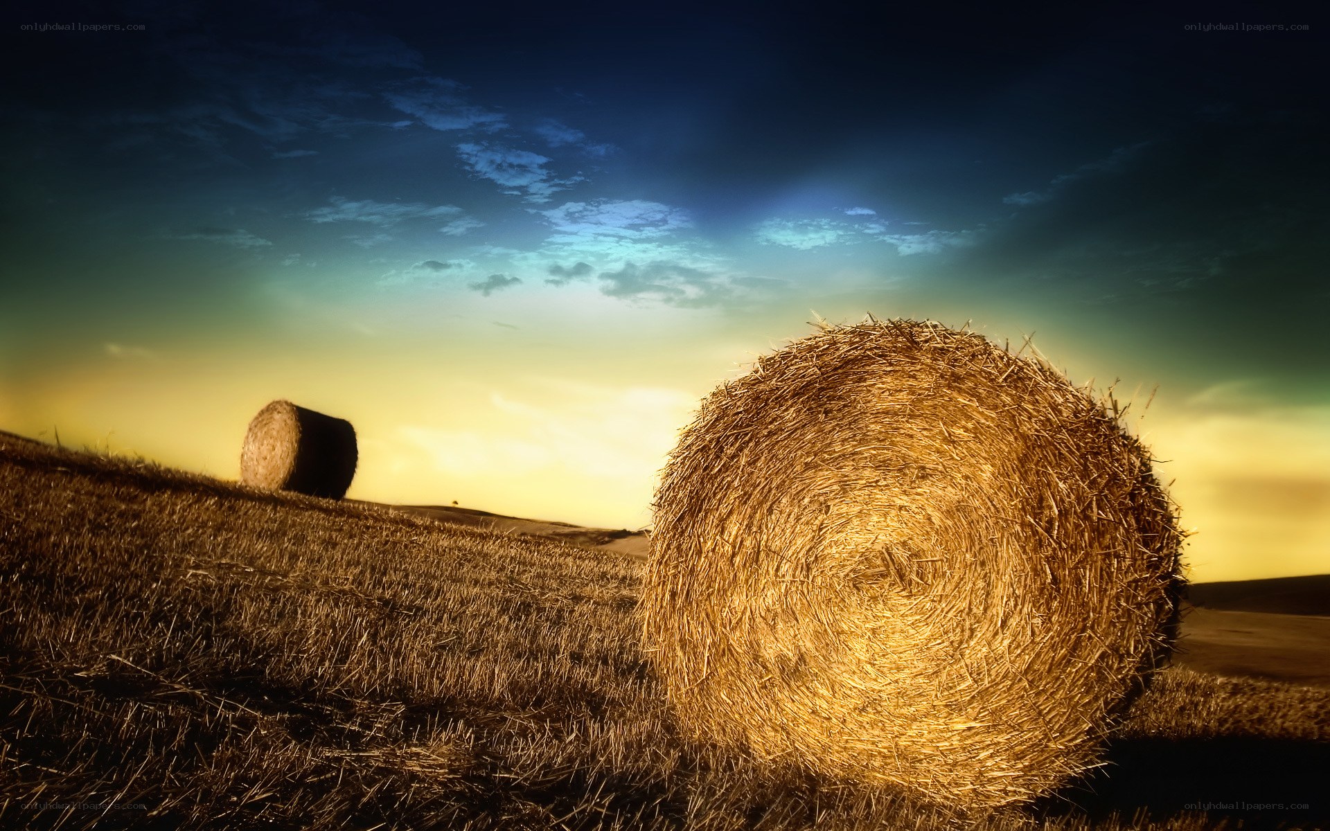 Hay bales at sunset