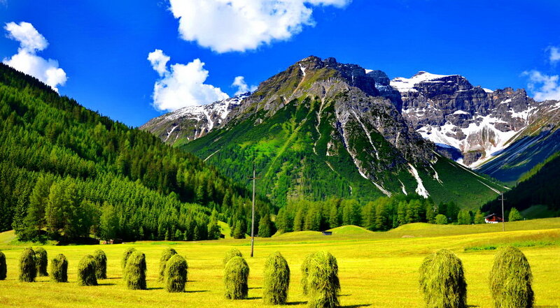 Hay Bales in Mountain Valley