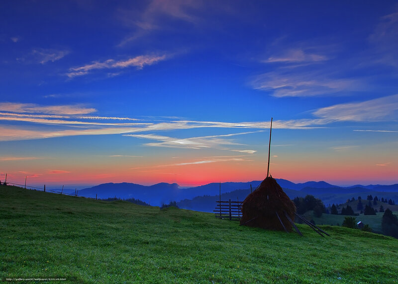 Haystack at sunset in the mountains