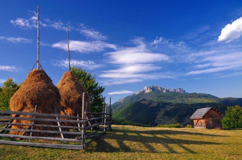 Haystacks in Mountain Valley — Blue
