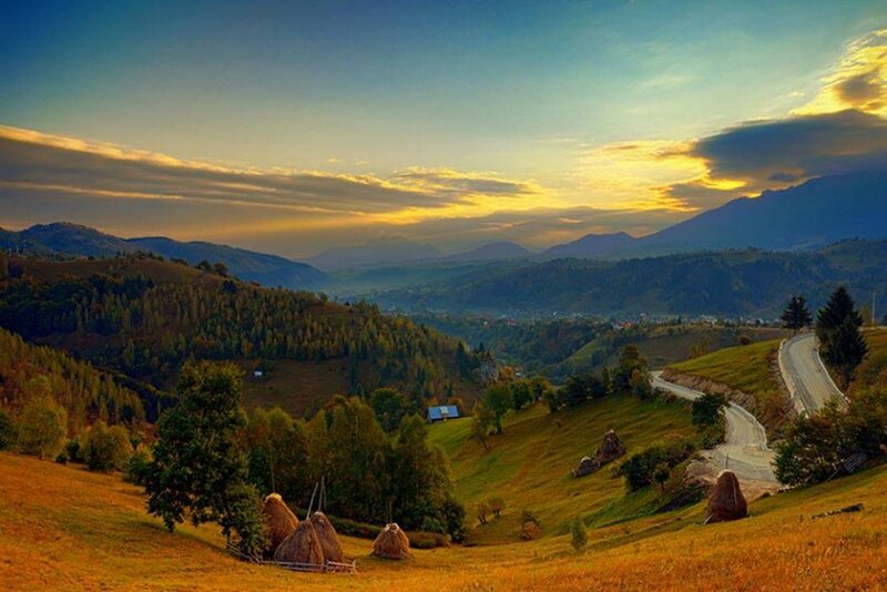 Haystacks in Valley — Green, Serene