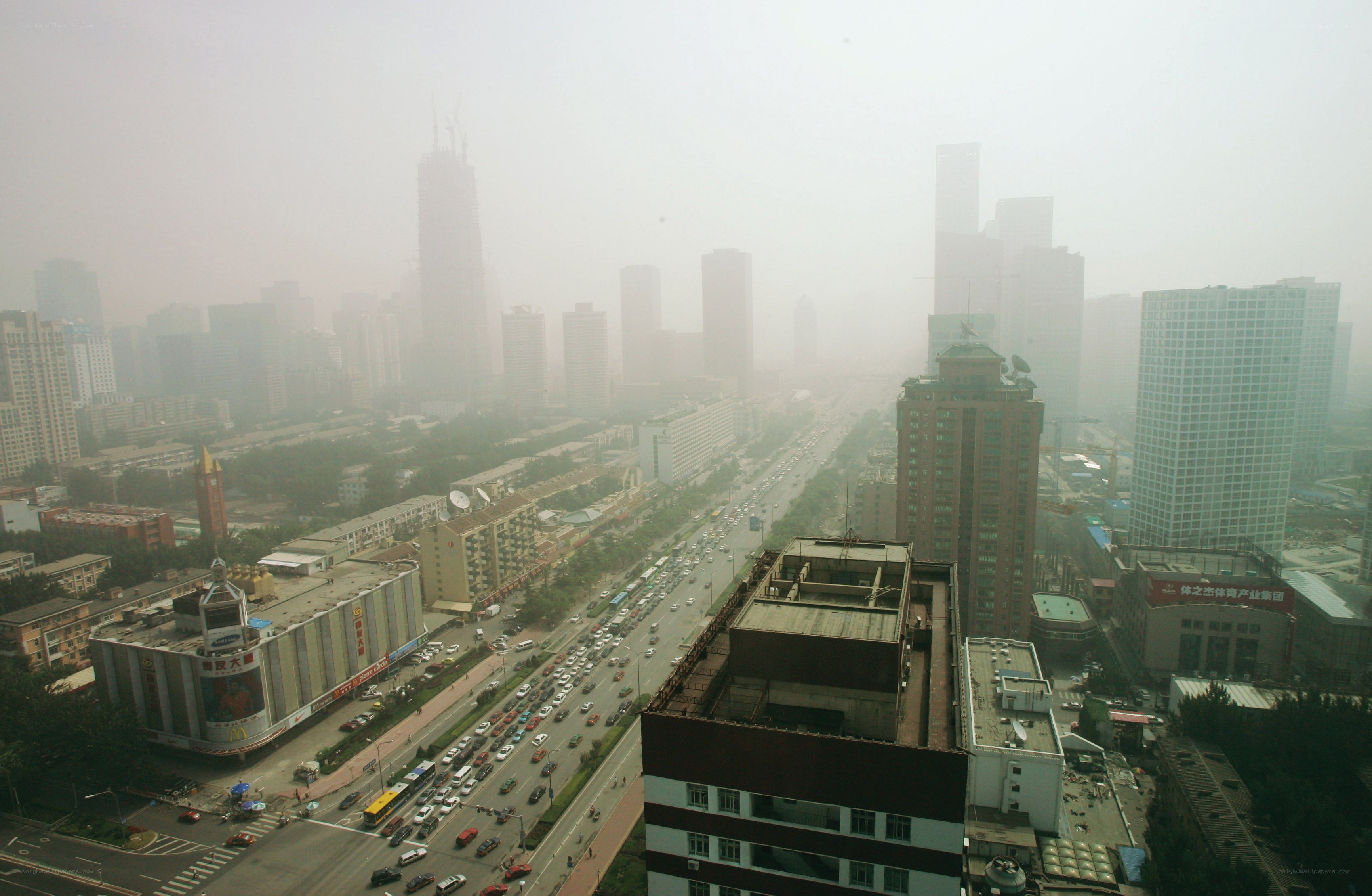 Hazy city skyline with traffic