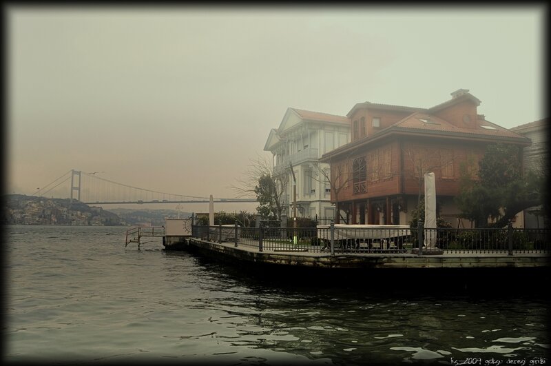 Hazy waterfront with bridge view