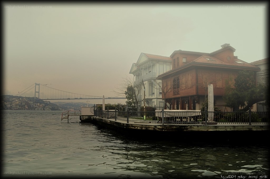 Hazy waterfront with bridge view