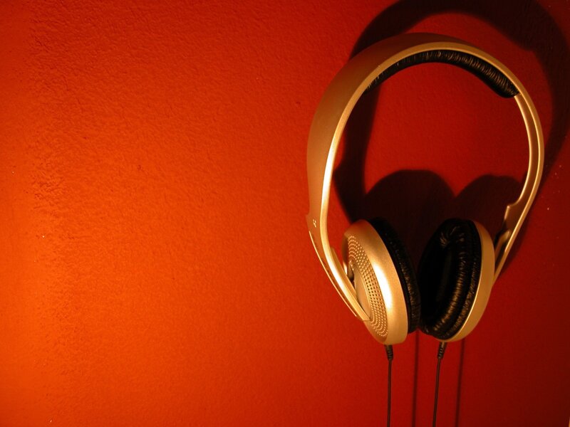 Headphones on a red wall