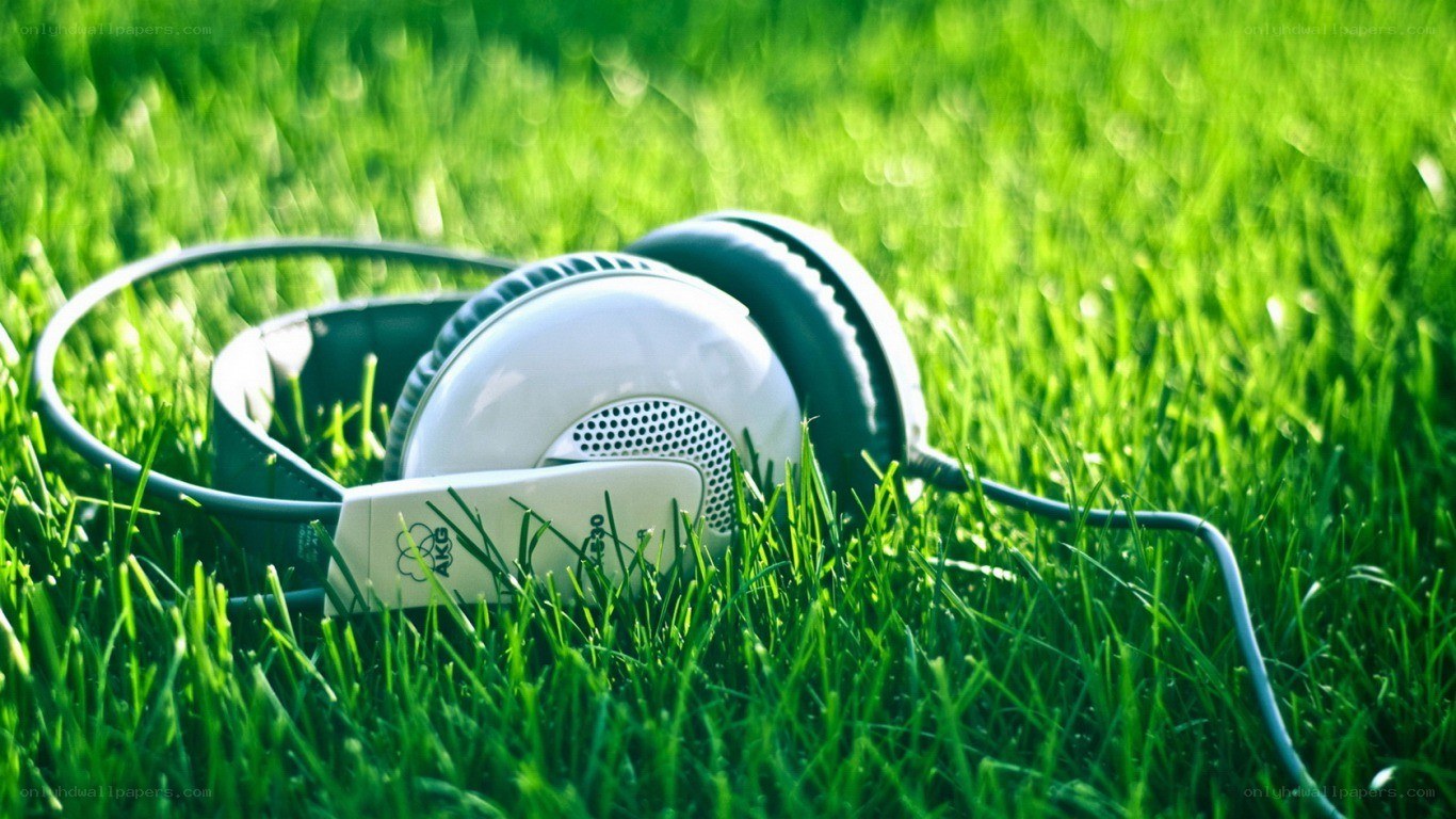 headphones on green grass