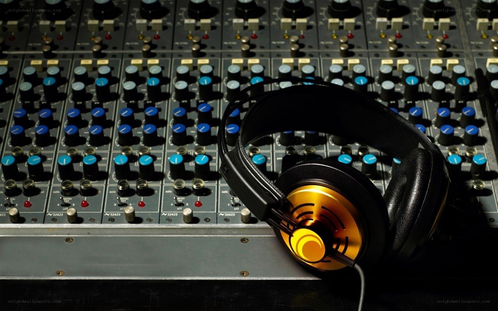 headphones on mixing console