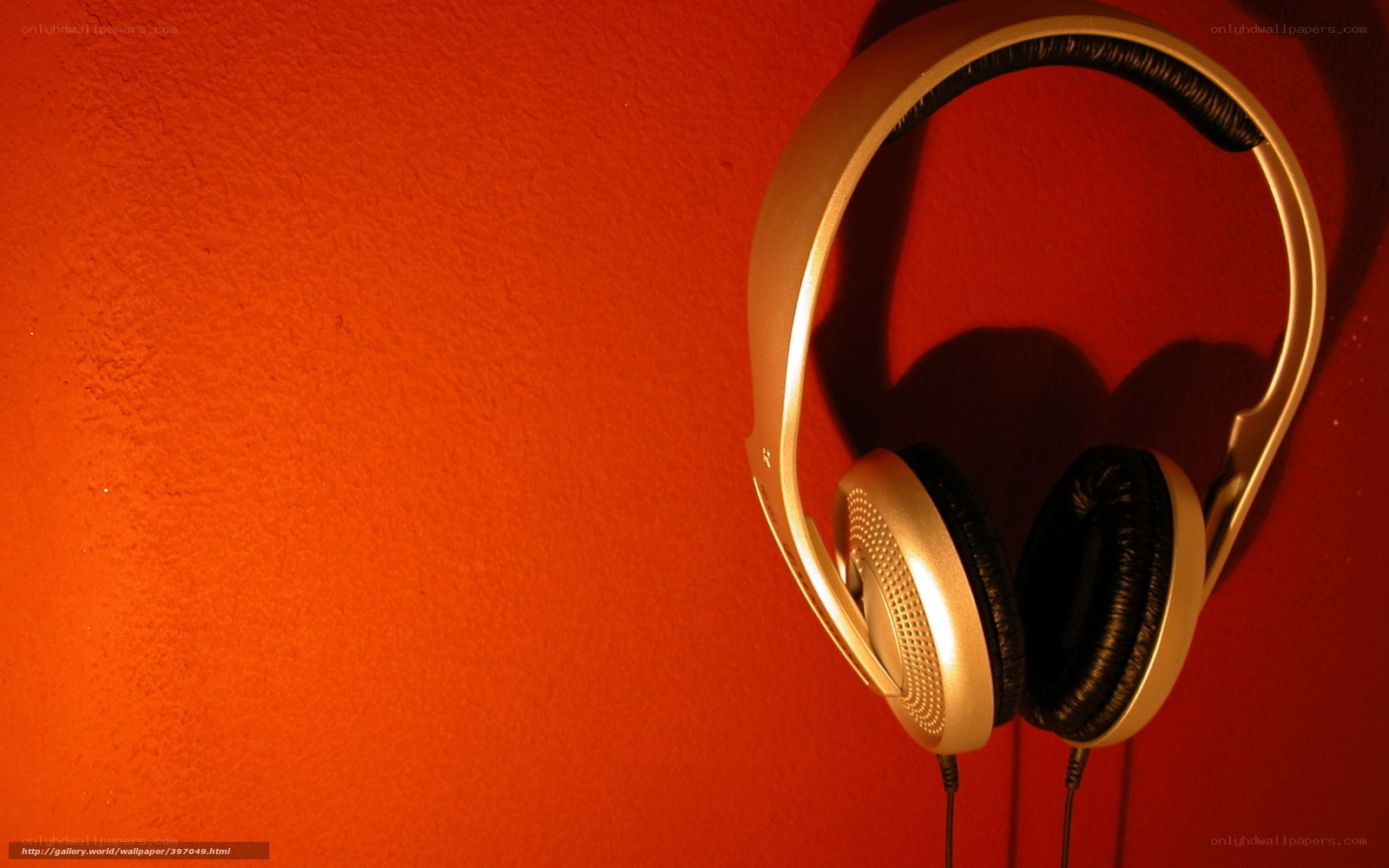 Headphones on red wall