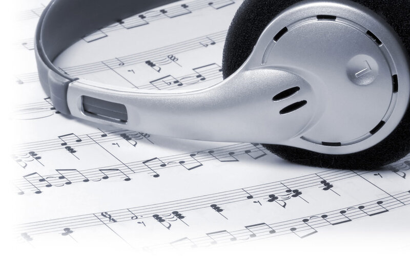 Headphones on Sheet Music — White