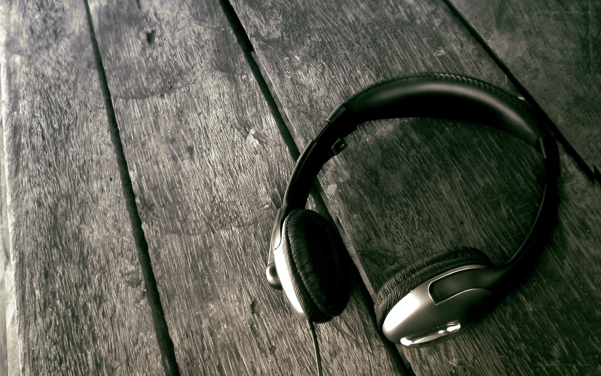 headphones on wooden surface