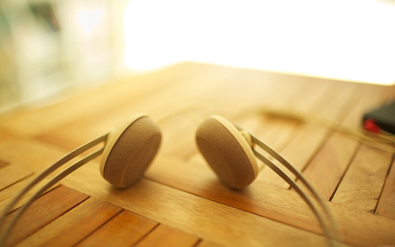Headphones on Wooden Surface — Brown