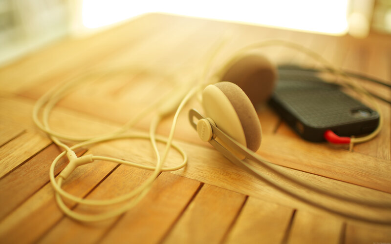 Headphones on Wooden Table — Brown