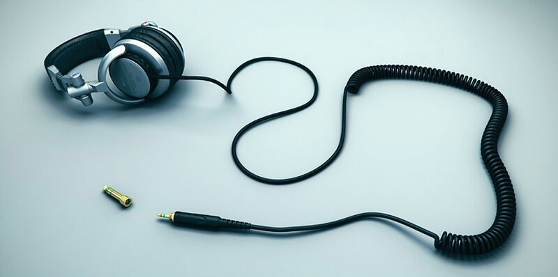 Headphones with coiled cable