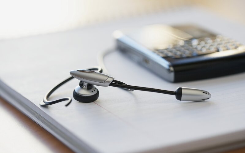 headset on notebook with phone