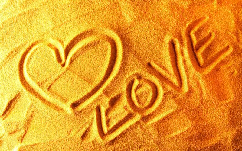 Heart and Love Carved in Sand