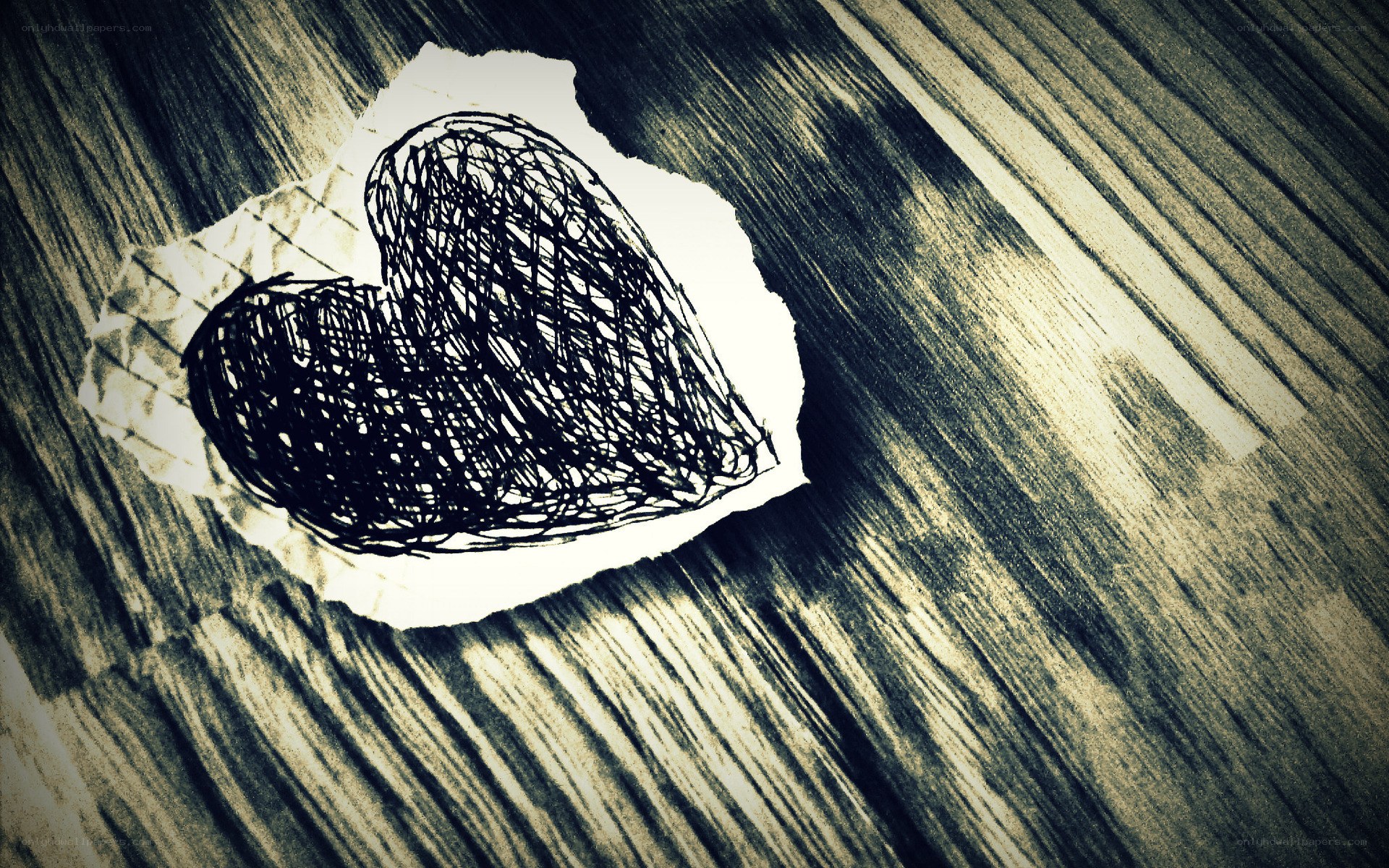 heart drawing on torn paper