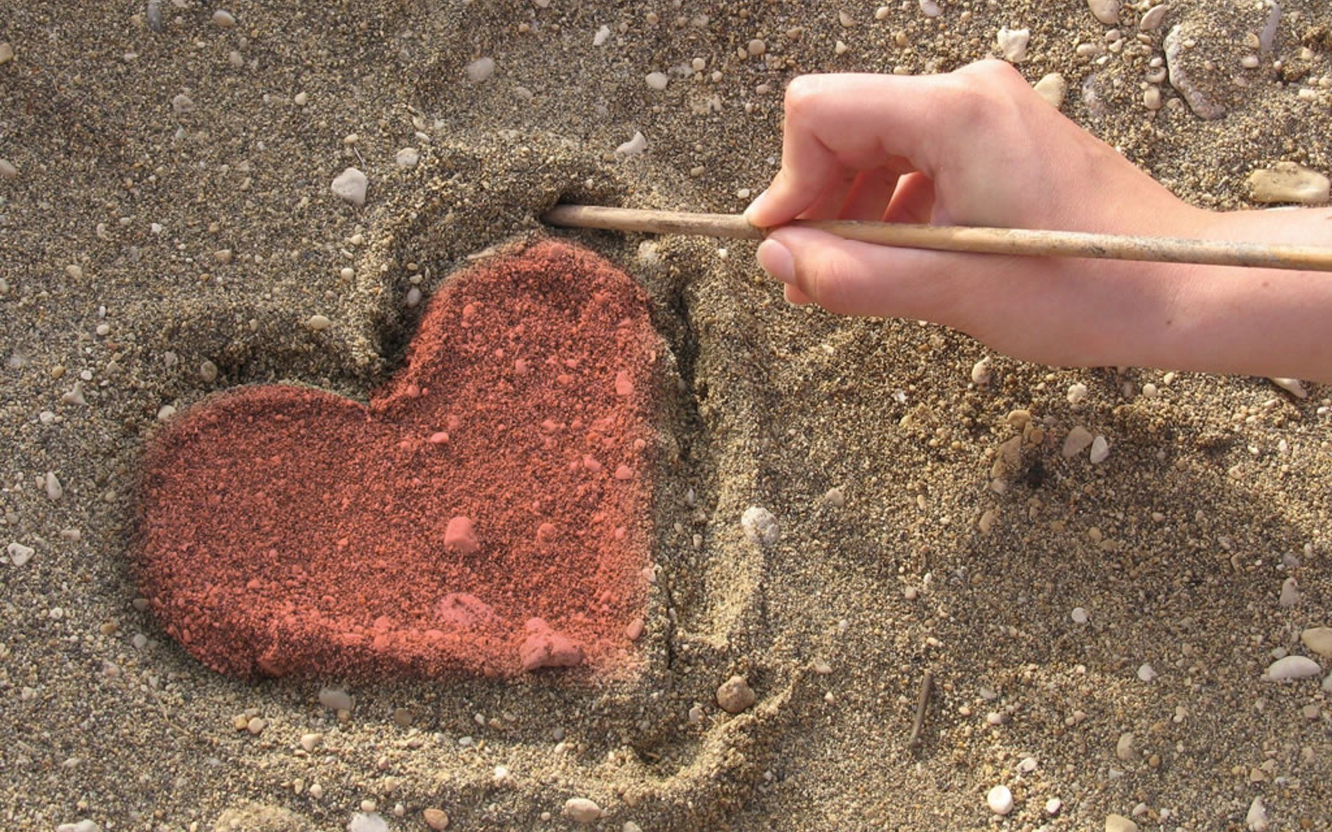 heart drawn in sand