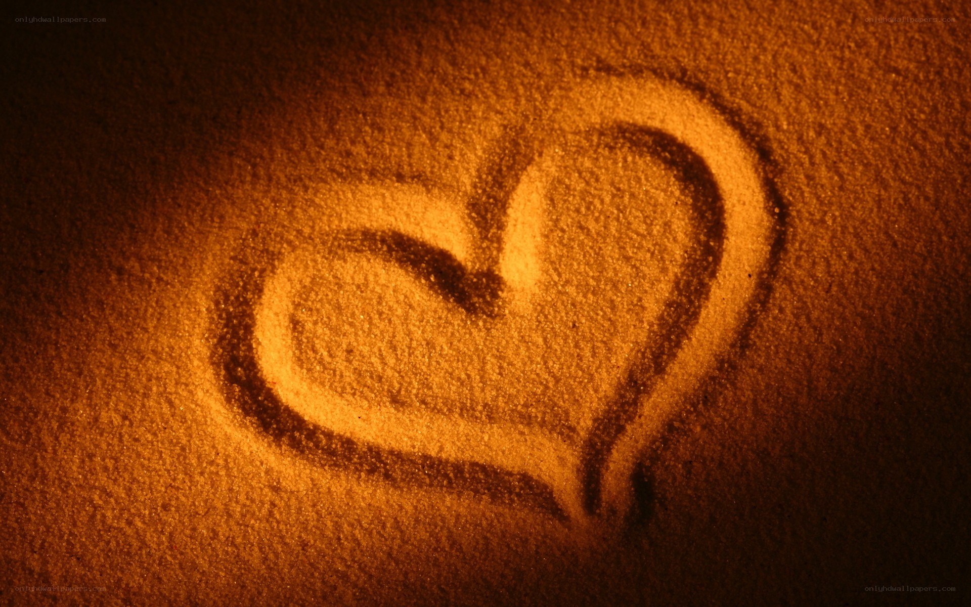 heart drawn in sand