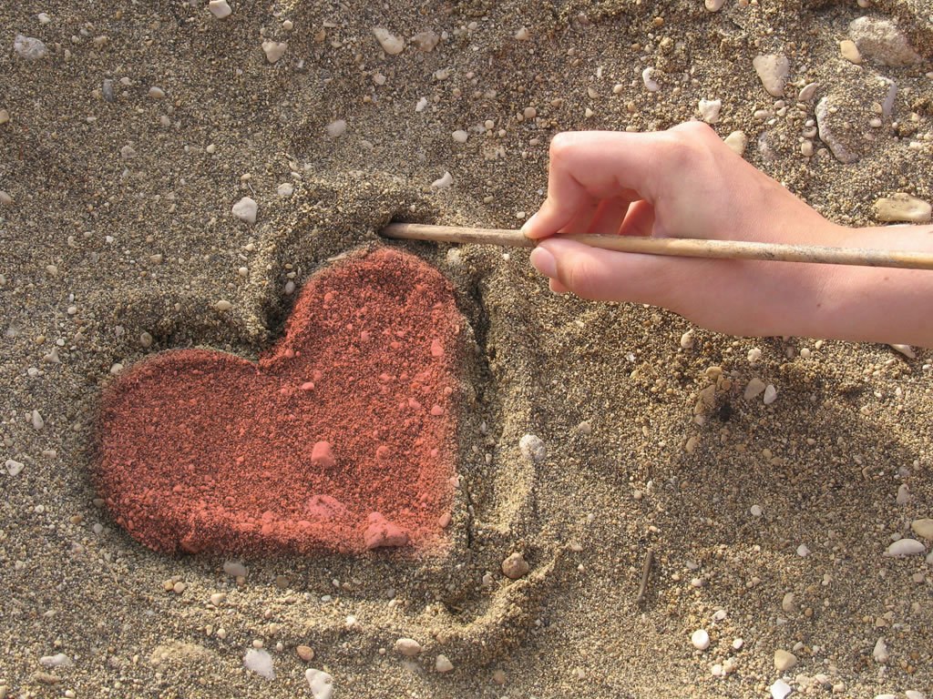 heart drawn in sand