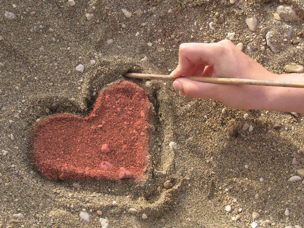 heart drawn in sand