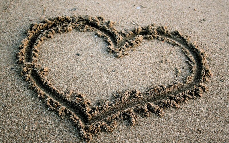 heart drawn in the sand