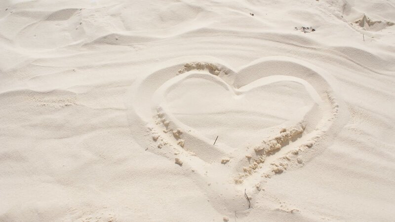 heart drawn in the sand