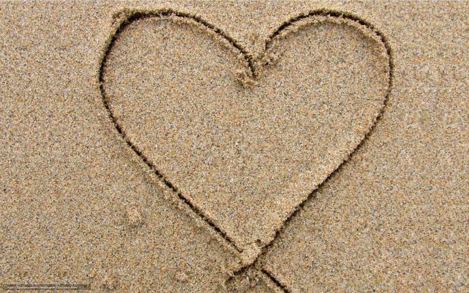 heart drawn in the sand