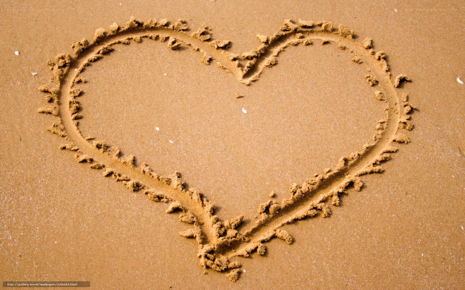 Heart drawn in the sand