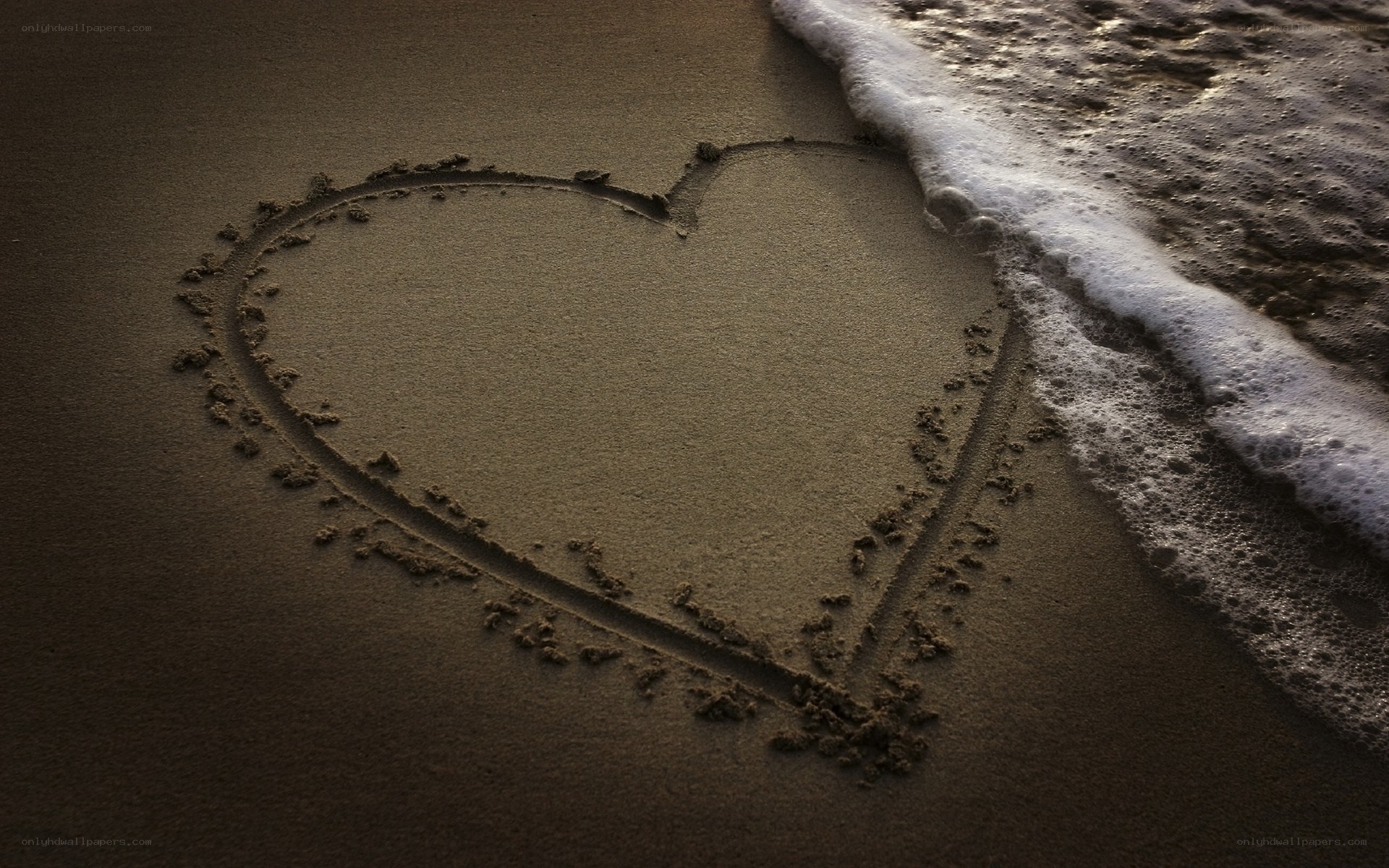 heart drawn in the sand