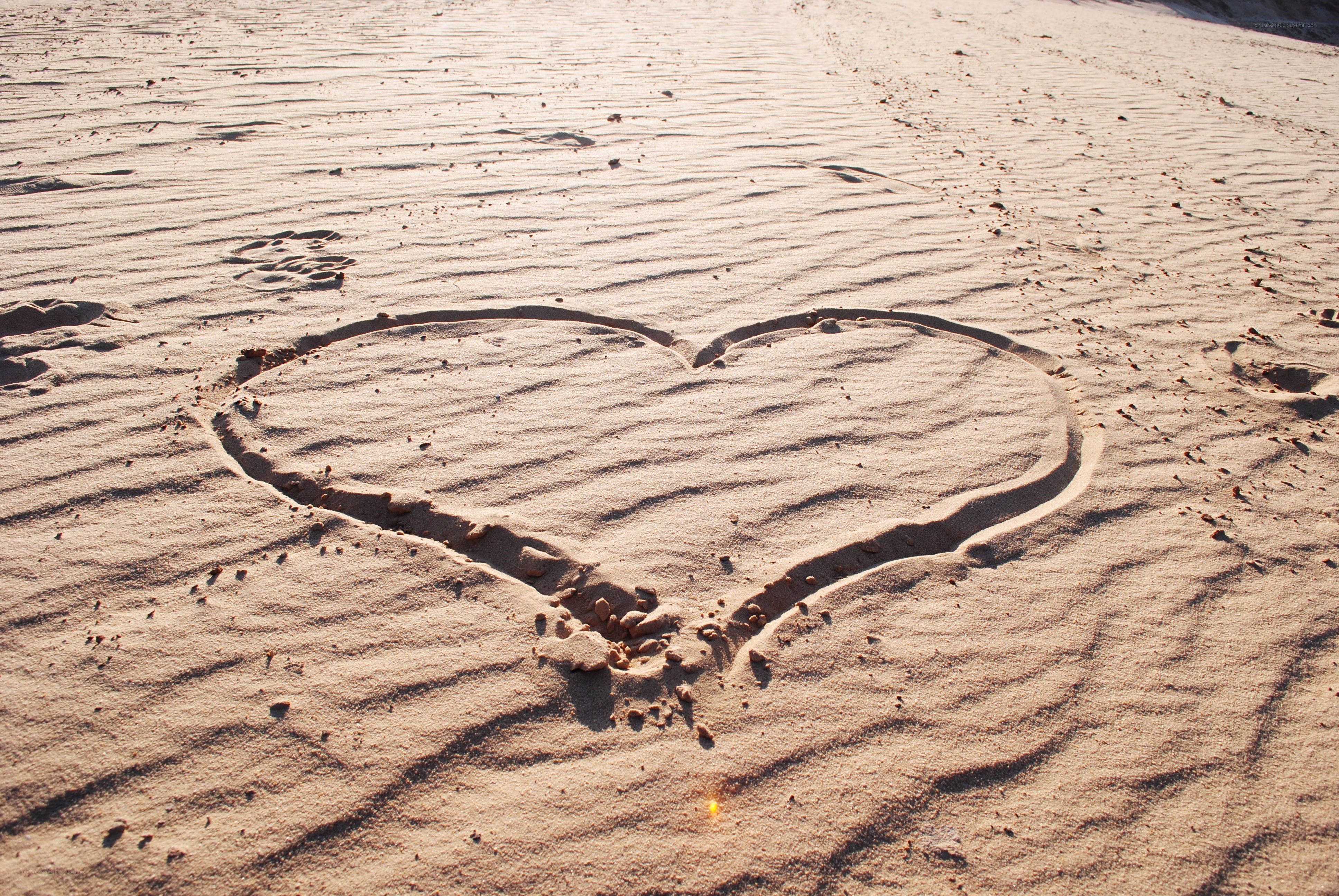 heart drawn in the sand