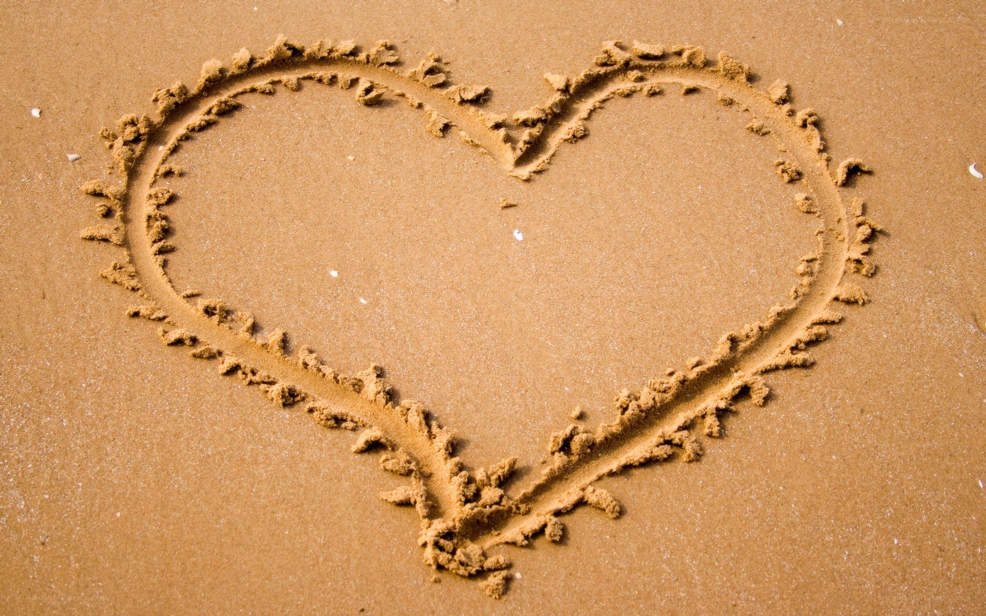 heart drawn in the sand
