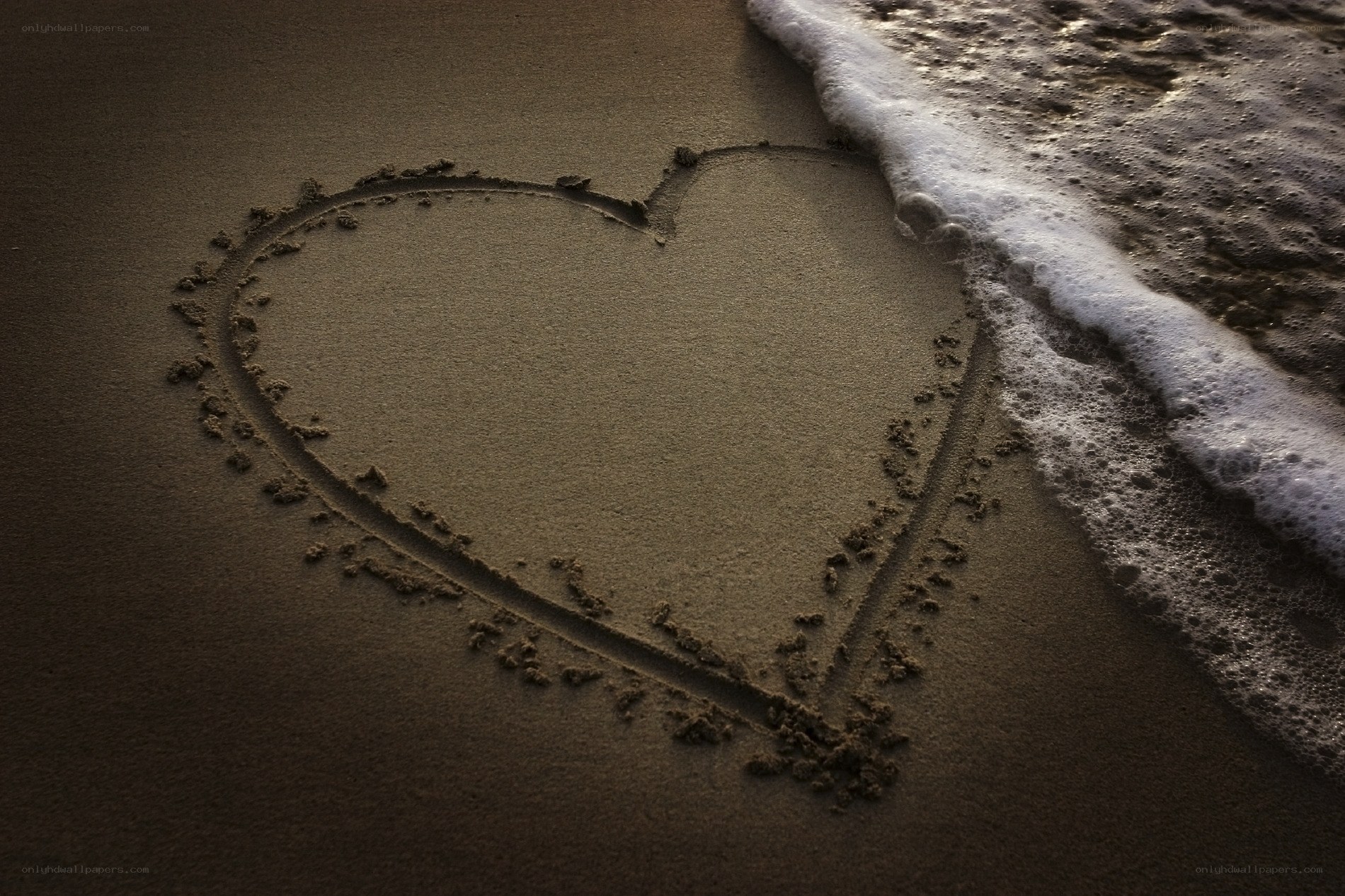 heart drawn in the sand