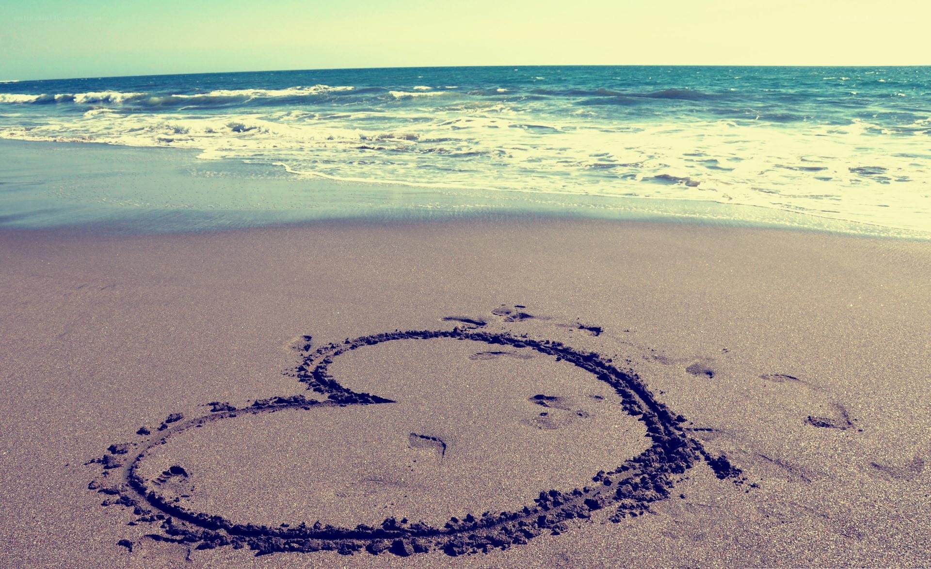 Heart drawn on beach sand