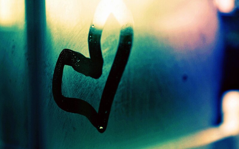 heart drawn on foggy glass