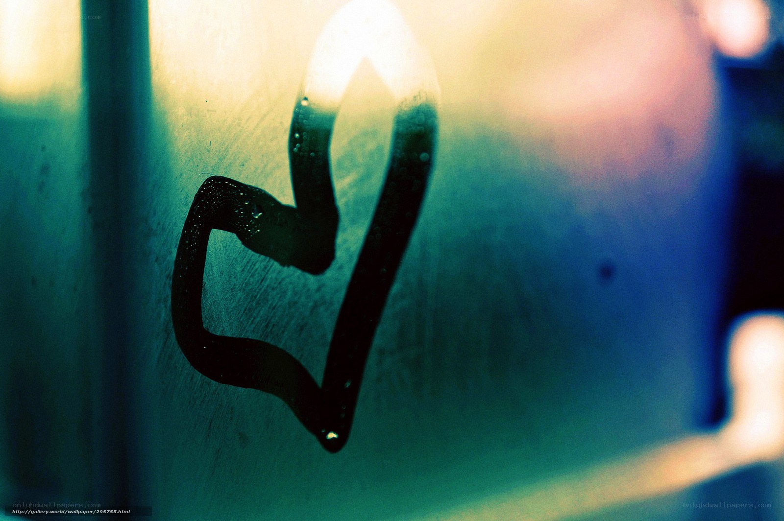 heart drawn on foggy glass